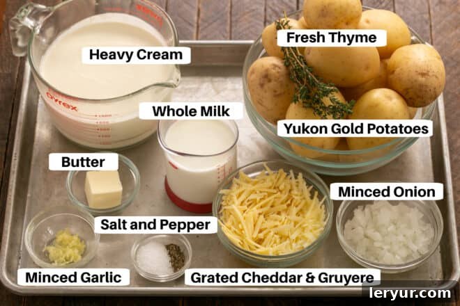 The Only Scalloped Potatoes You'll Ever Need 2 Scalloped Potatoes ingredients on a metal sheet pan with labels, including potatoes, cheeses, cream, milk, and herbs.