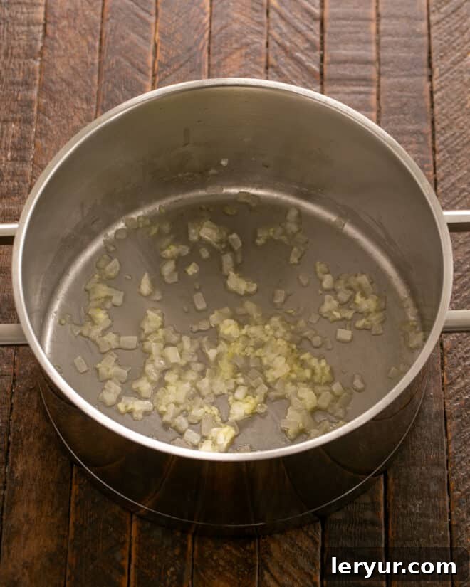 The Only Scalloped Potatoes You'll Ever Need 3 Onion and garlic cooked in butter, fragrant and softened in a large pot.