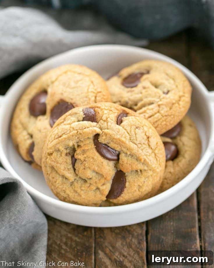Irresistible Brown Butter Chocolate Chip Cookies, golden-brown with molten chocolate, offering a boost of deliciousness from nutty brown butter and dark brown sugar!