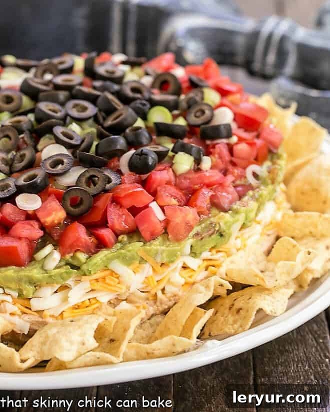 Side view of a perfectly layered 7 Layer Dip, showcasing each distinct ingredient layer.