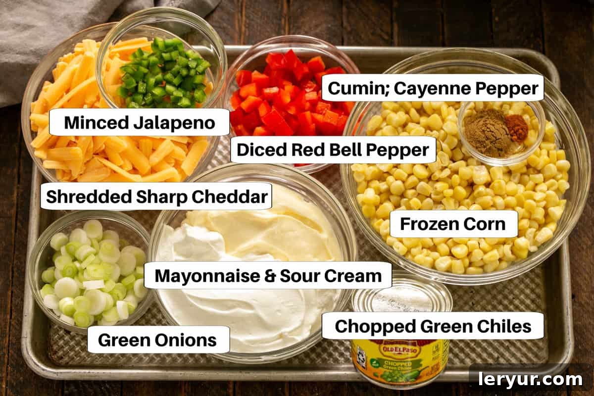 Sour Cream Corn Dip Ingredients on a sheetpan with labels.