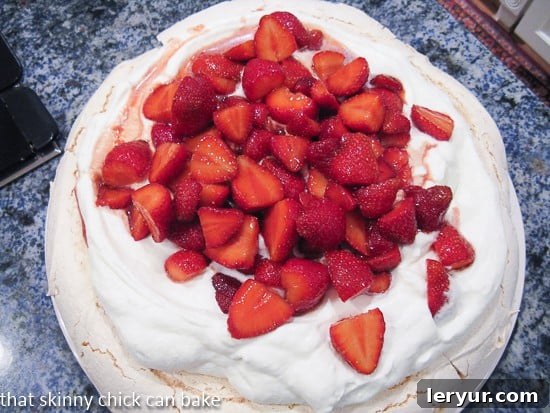 Overhead view of strawberry pavlova on the kitchen counter Strawberry Pavlova