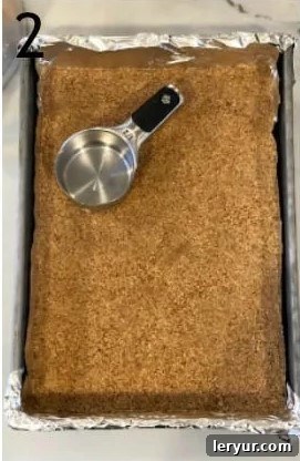 Blackberry Cheesecake Bliss Bars 3 The delicious crumb crust mixture for cheesecake bars pressed onto the bottom of a baking pan.