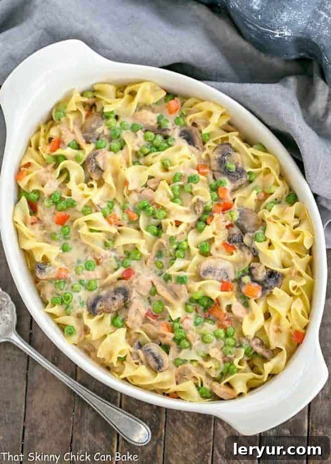 A wholesome tuna noodle casserole, prepared from scratch in an oval white dish.