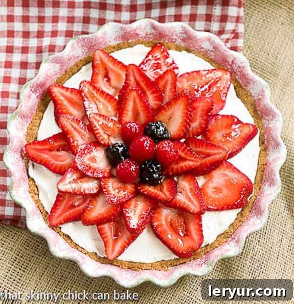Strawberry Cream Cheese Dessert | A dreamy cream cheese and whipped cream filling topped with juicy ripe strawberries!