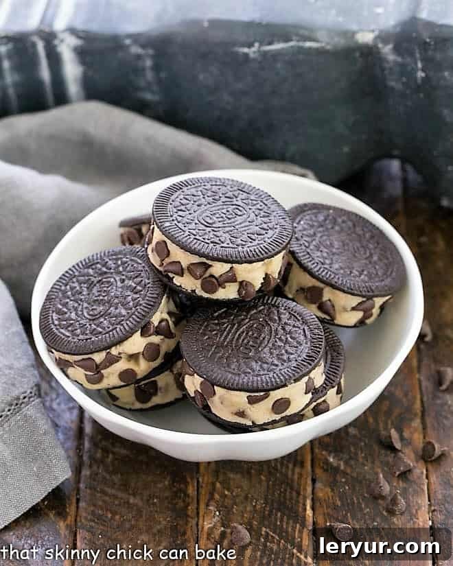 Oreo Cookie Dough Treats - An easy semi-homemade recipe made with safe, edible cookie dough nestled in an Oreo Cookie Oreo Cookie Dough Treats in a white bowl, showcasing their delicious homemade filling.