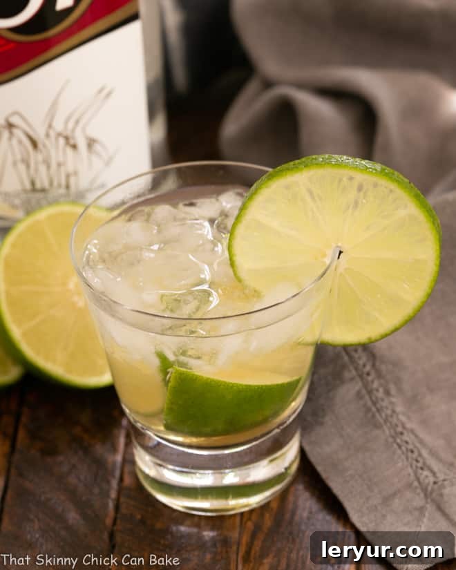 Caipirinha The Taste of Brazil 2 Caipirinha Cocktail with a bottle of Cachaça.
