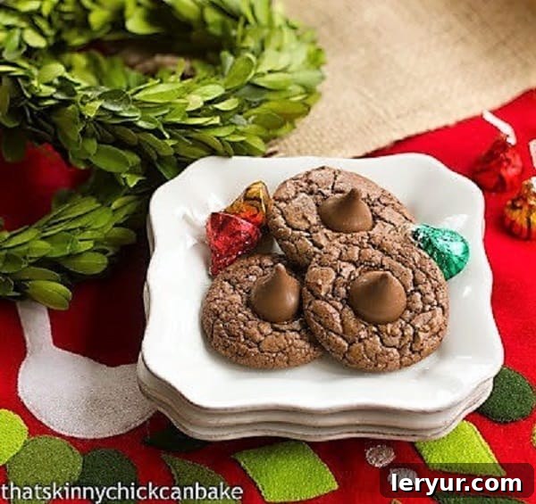 Double Chocolate Thumbprint Cookies elegantly stacked on square white plates, ready to be served.