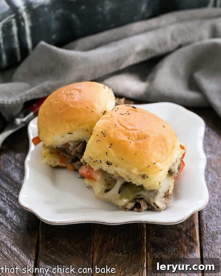 Two slider sandwiches on a small white ceramic plate