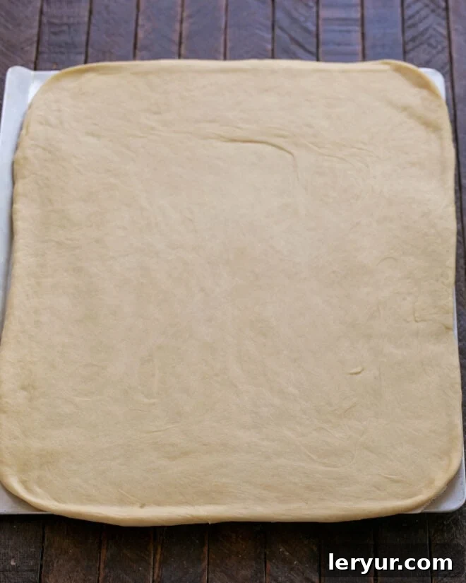 Dough meticulously rolled out into an 18 x 12-inch rectangle on a lightly floured countertop.