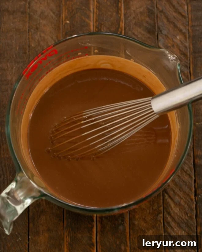 Decadent Italian Chocolate Budino 11 Chocolate pudding being whisked until all ingredients are thoroughly combined and smooth.