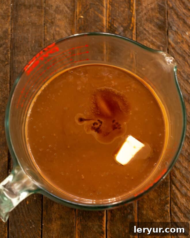 Decadent Italian Chocolate Budino 10 Butter, salt, and vanilla extract being added to the chocolate pudding mixture.