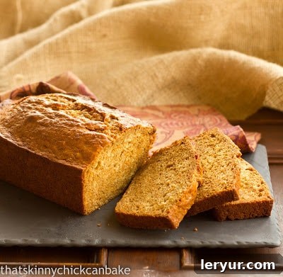 A perfectly sliced sweet potato bread loaf on a rustic slate board, ready to be enjoyed as a healthy autumnal treat.