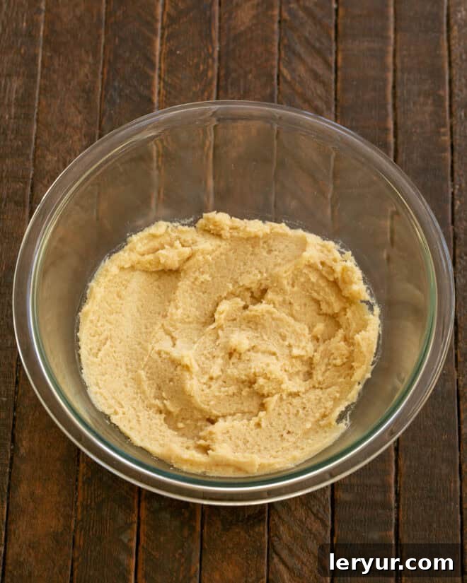 Step 1: Beat butter and sugars until light and fluffy in a mixing bowl.