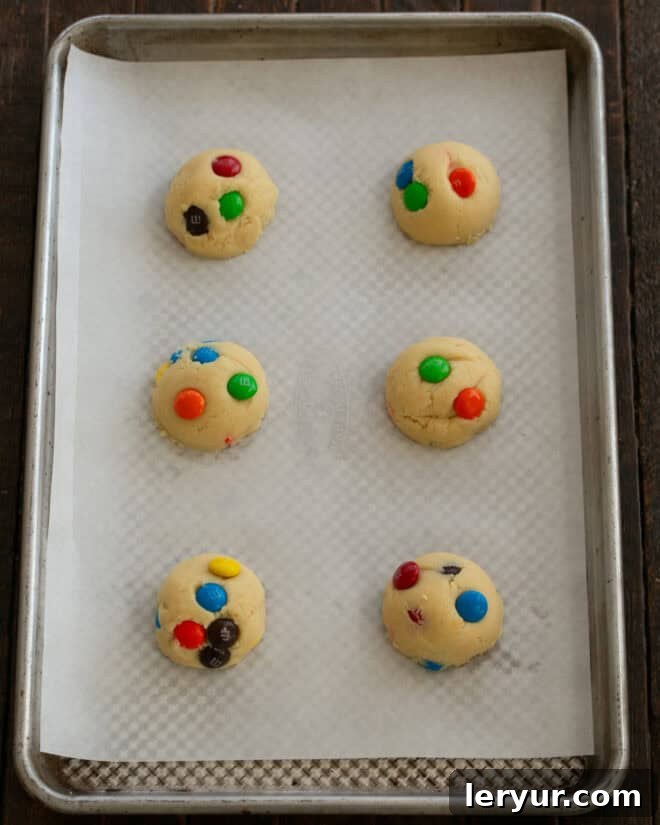 Step 5: Scoop dough into balls, flatten slightly, and arrange on a baking sheet.