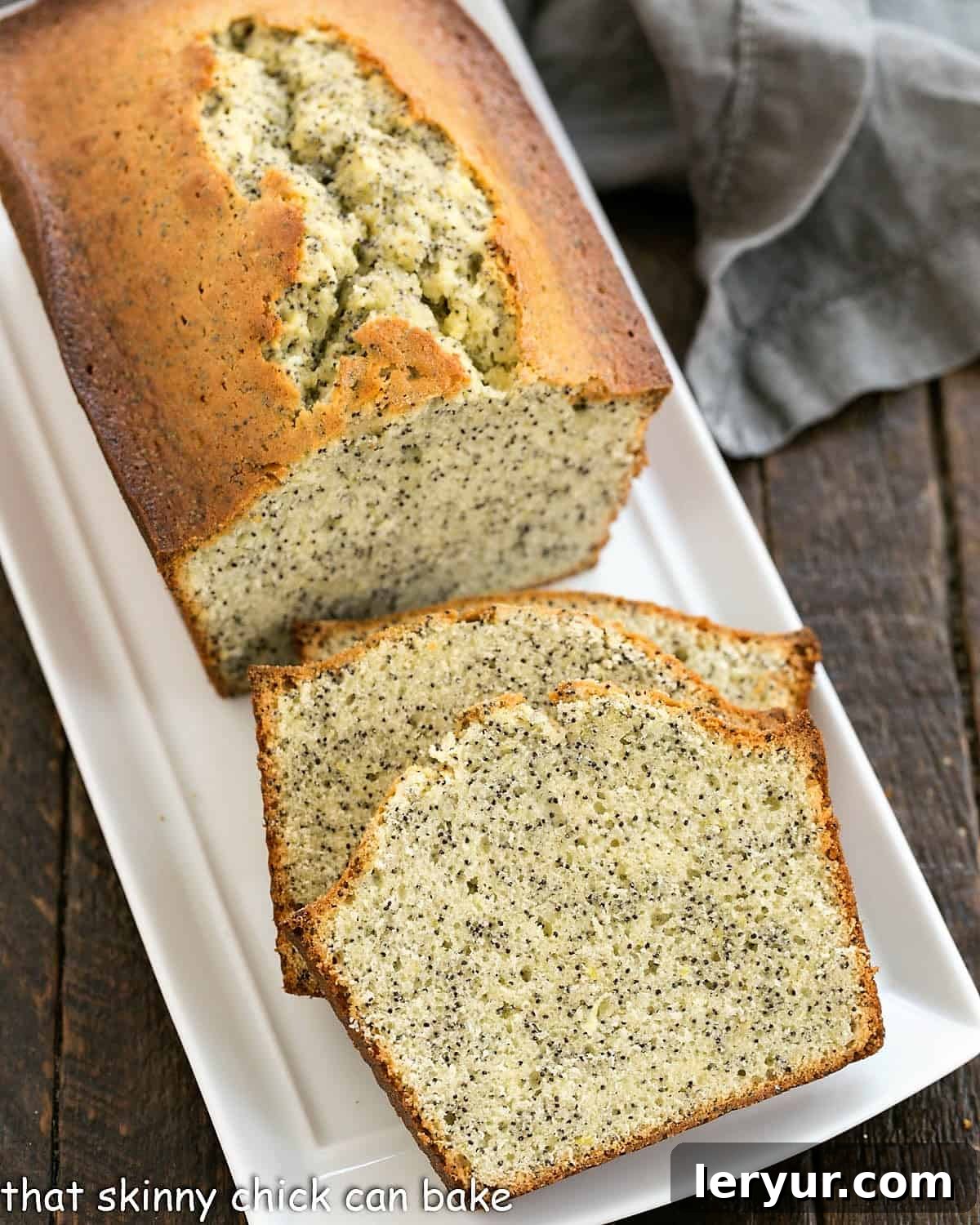 Sun-Kissed Lemon Poppy Seed Loaf 4 Sliced lemon poppy seed loaf on a white ceramic tray.