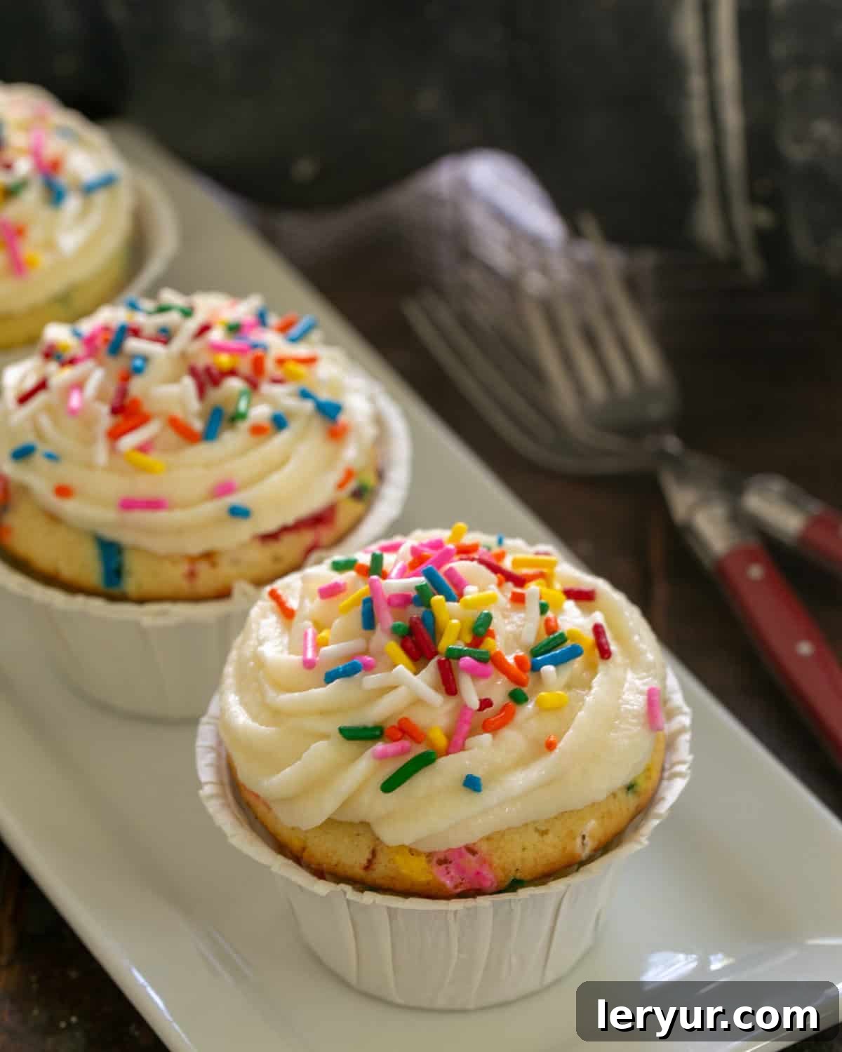 Funfetti Cupcakes on a white ceramic tray.