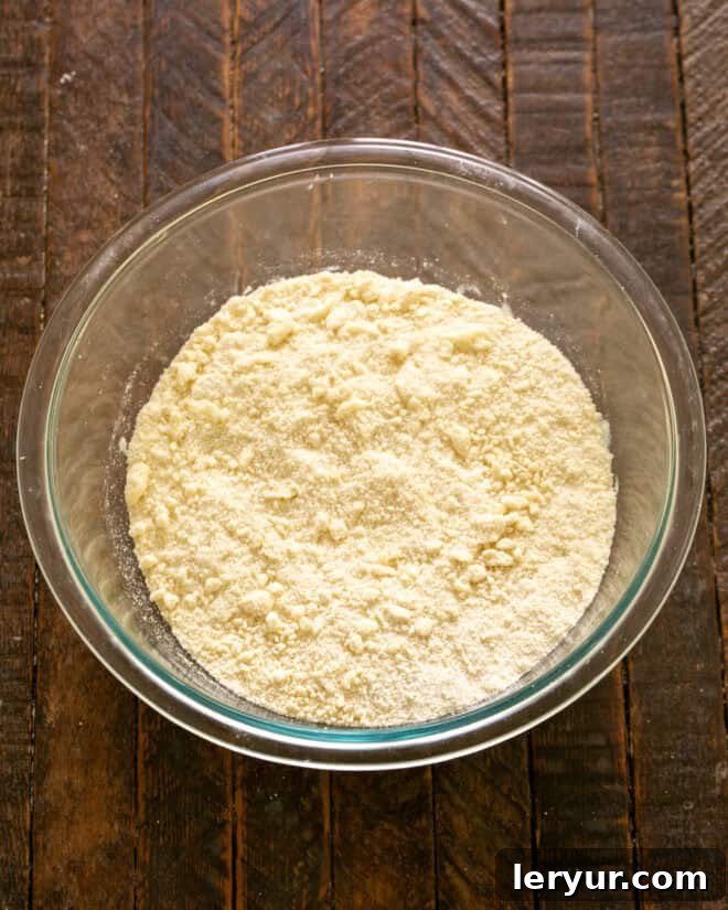 Mix until it looks like coarse crumbs.